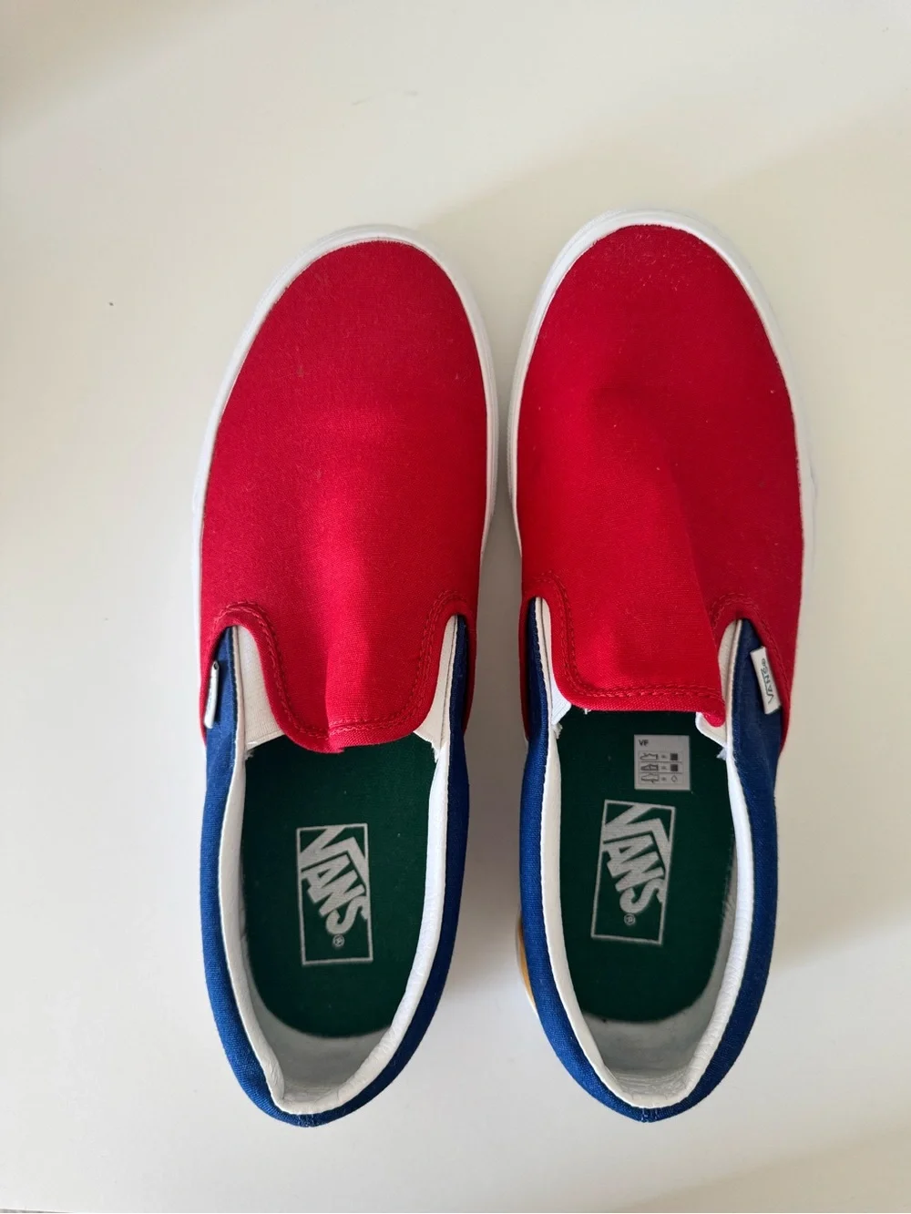 Vans Men’s Slip-On Sneakers in Red and Blue Trim